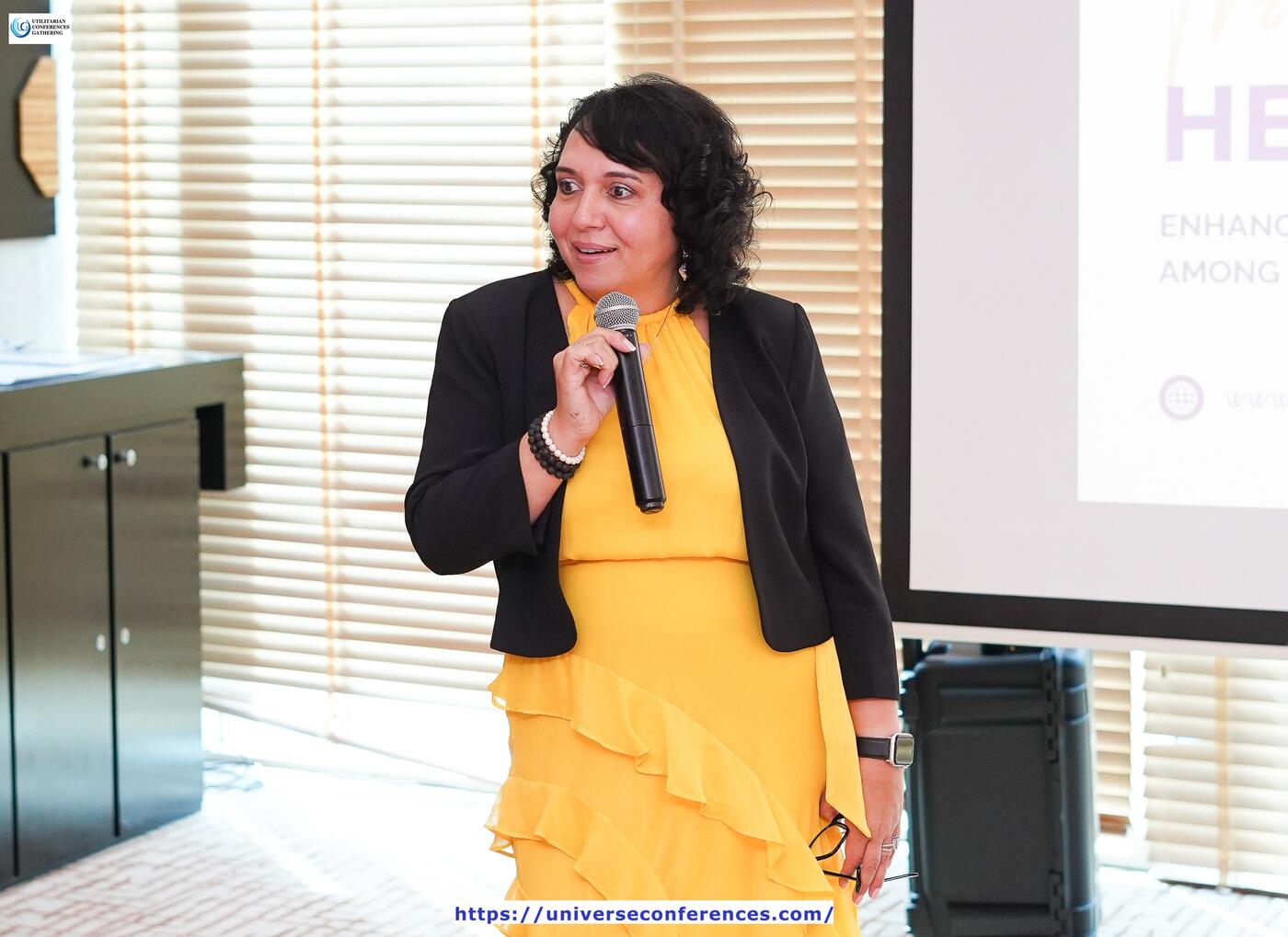 Christina Foxwell delivering a keynote on stage